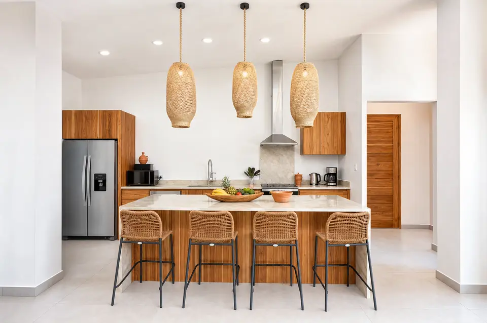 Noma Pura Vida kitchen with marble island and teak cabinets