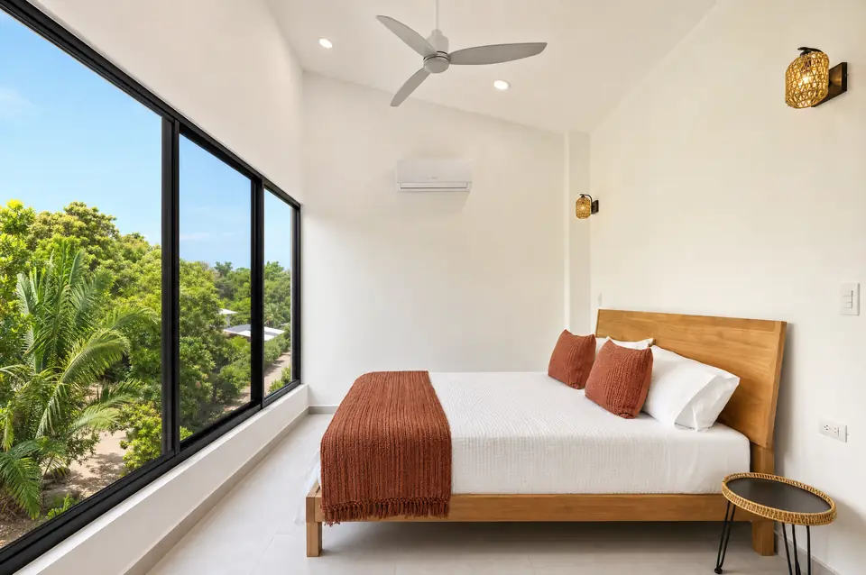 Noma Pura Vida master bedroom with linen bed