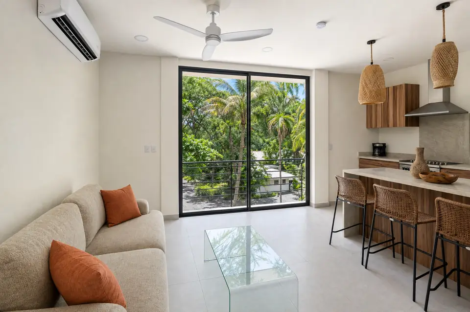 Casa Guiones living room open to the jungle canopy